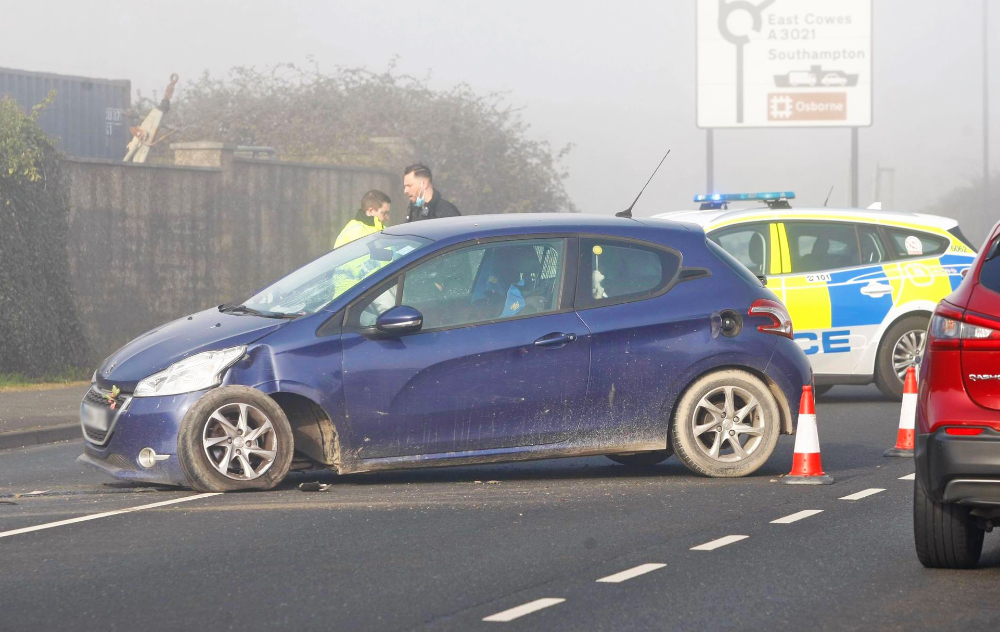 TRAFFIC BACKED UP AS CAR CRASHES INTO LAMP POST IN FOGGY CONDITIONS