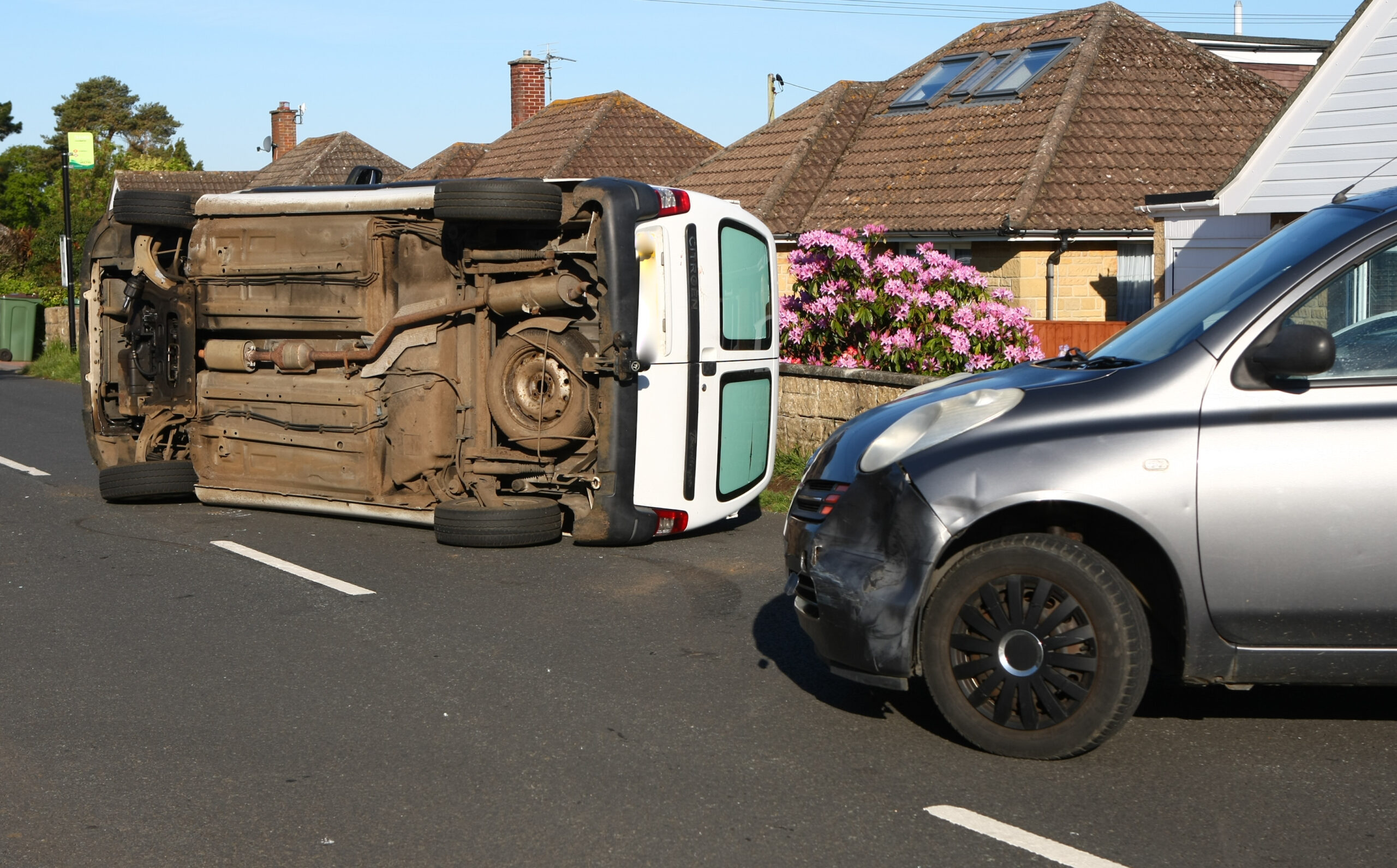 VAN ROLLS ONTO SIDE IN WINFORD AFTER CRASHING INTO MICRA