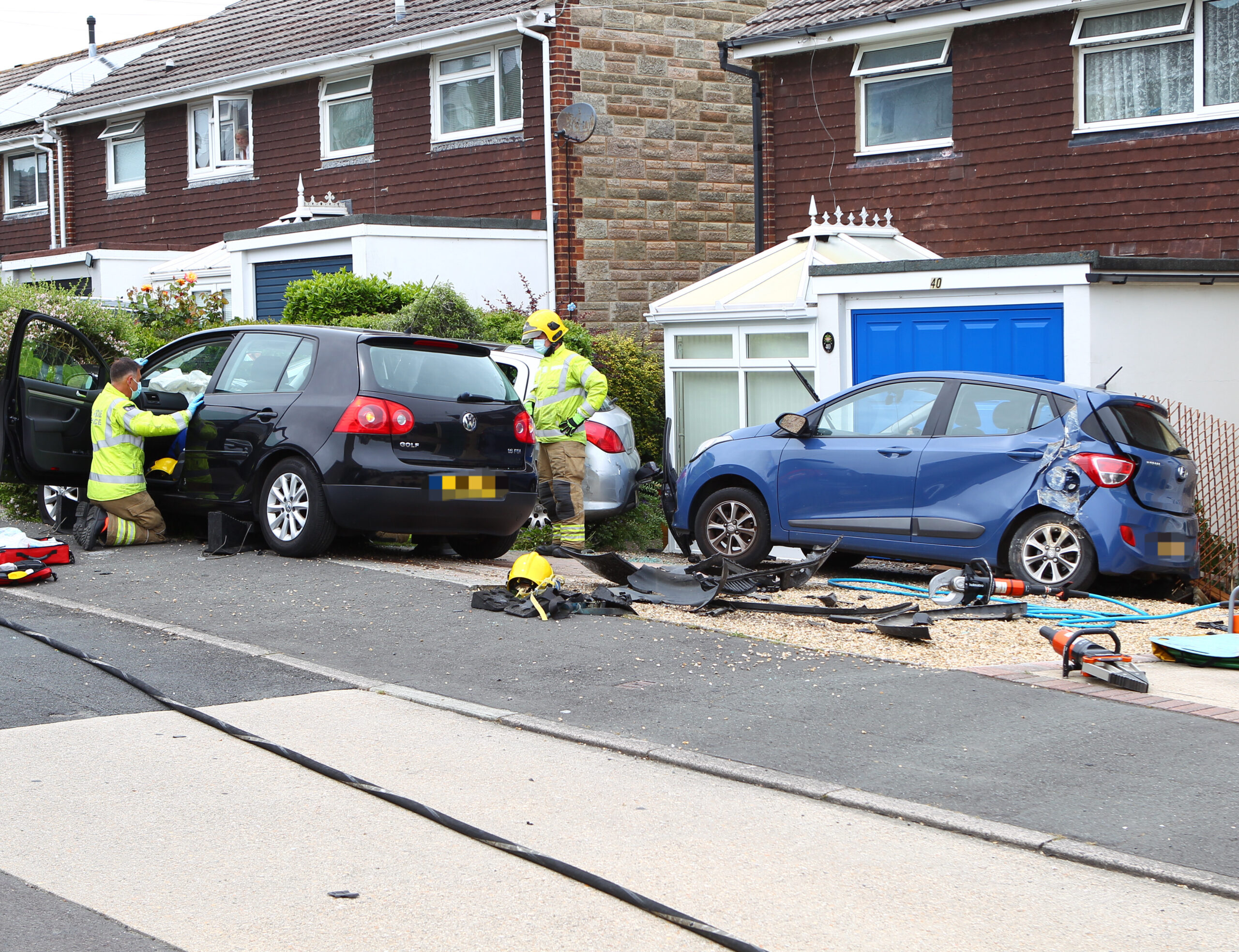 WOMAN TRAPPED IN CAR AFTER PLOUGHING INTO VEHICLES ON DRIVEWAY