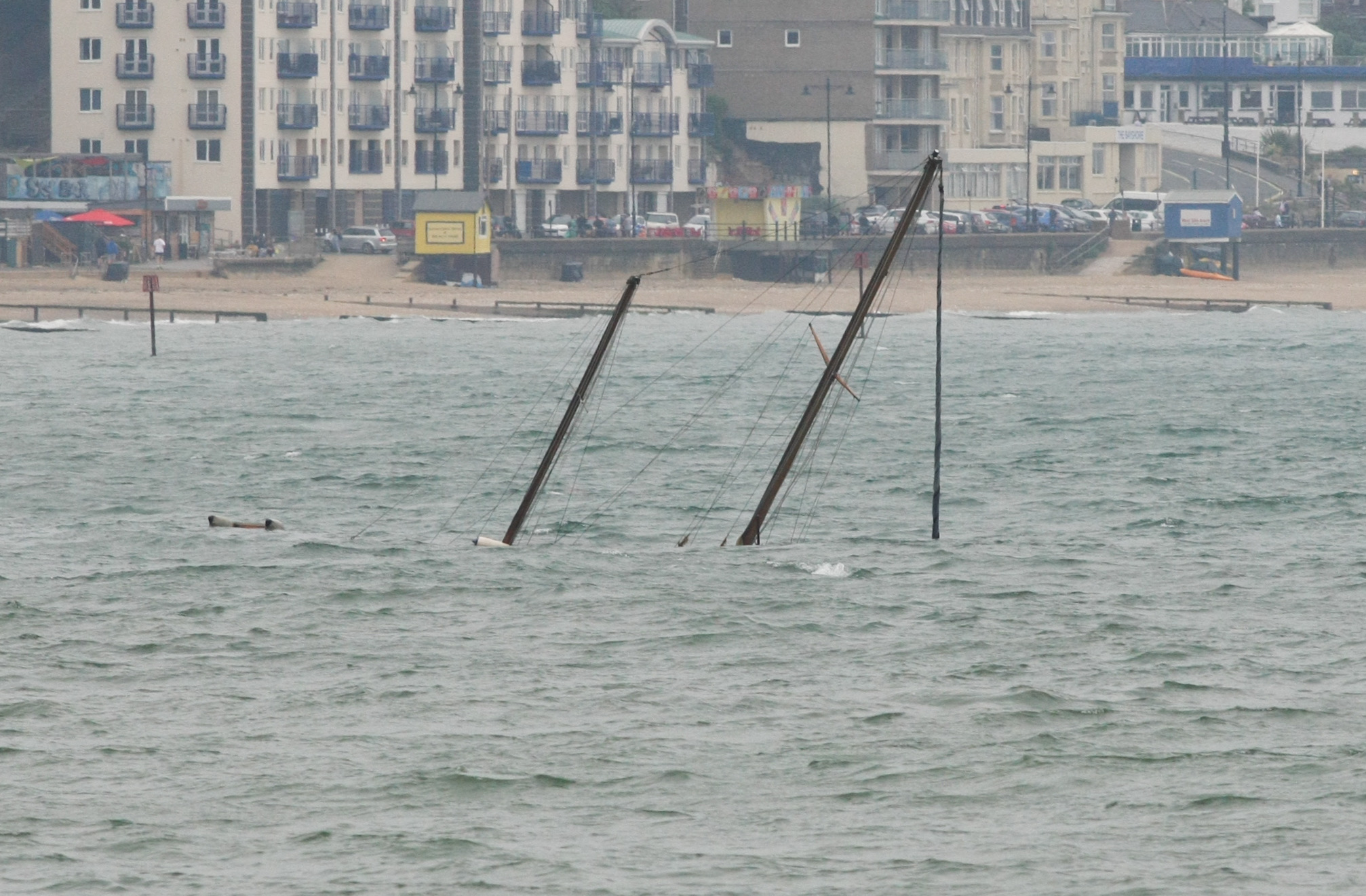 POLLUTION WARNING AS BOAT SINKS IN THE BAY