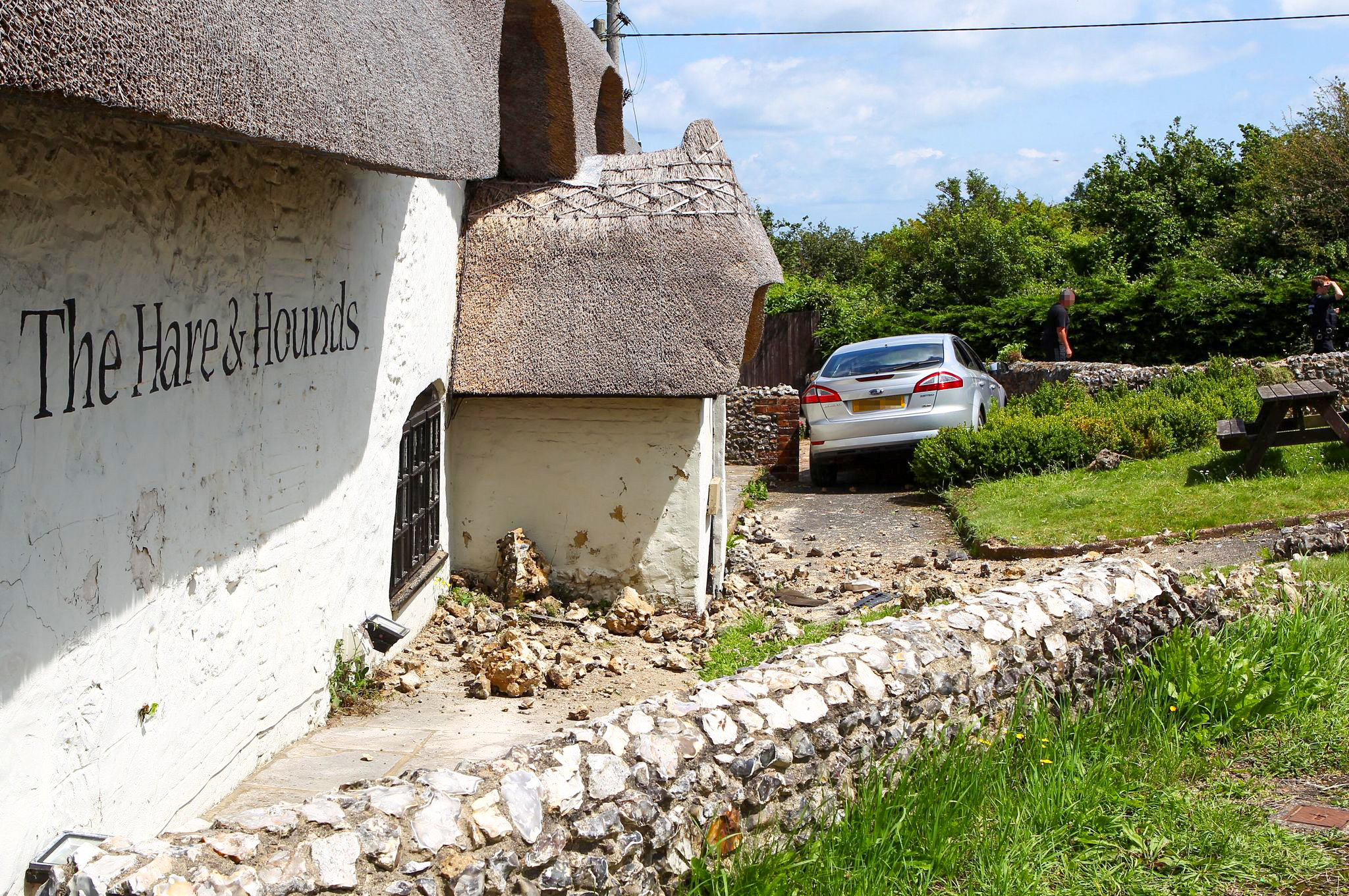 CAR PLOUGHS THROUGH WALL OUTSIDE POPULAR HARE & HOUNDS PUB