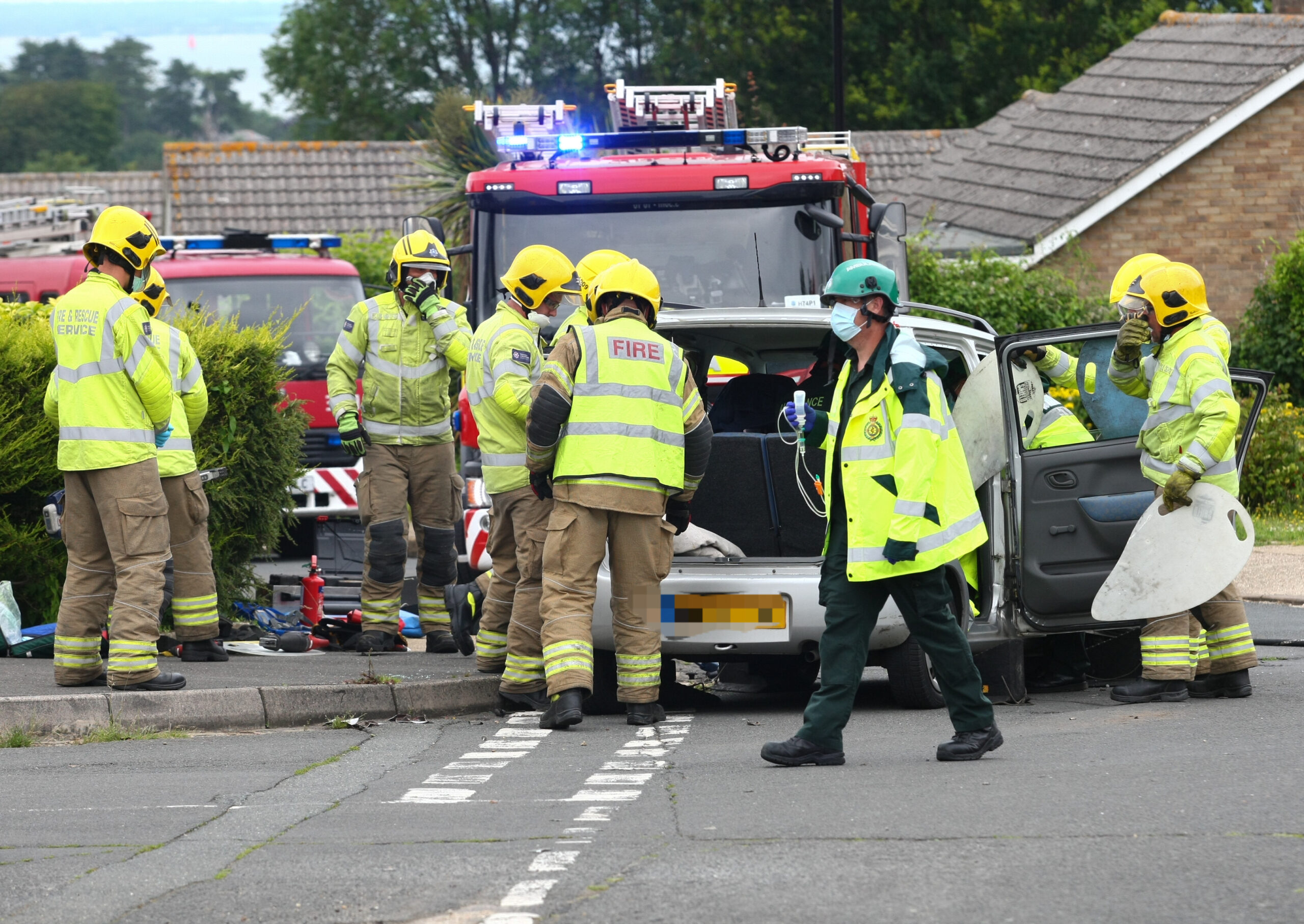 FIRE CREWS EXTRICATE COUPLE FROM CAR AFTER BINSTEAD CRASH