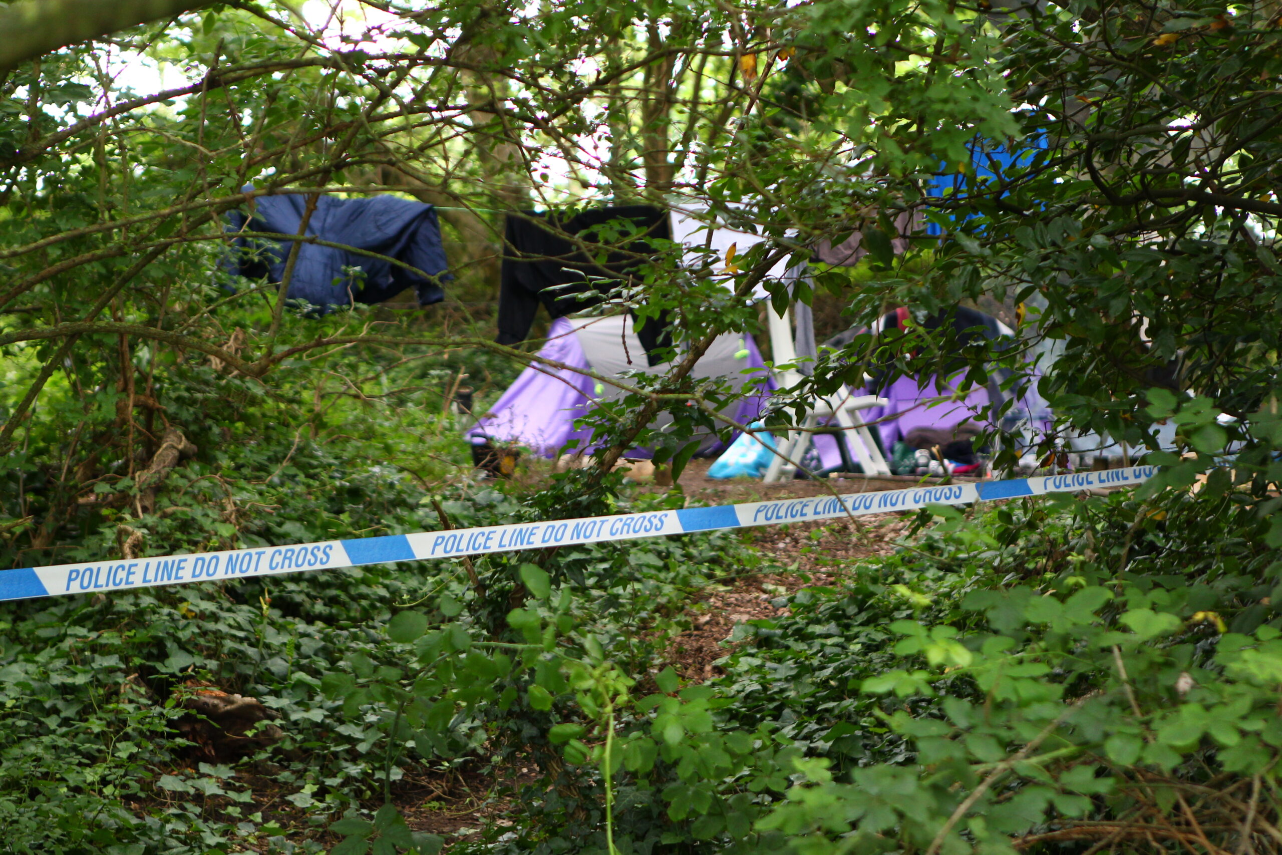 POLICE CORDON OFF WOODLAND AS PART OF GBH INVESTIGATION
