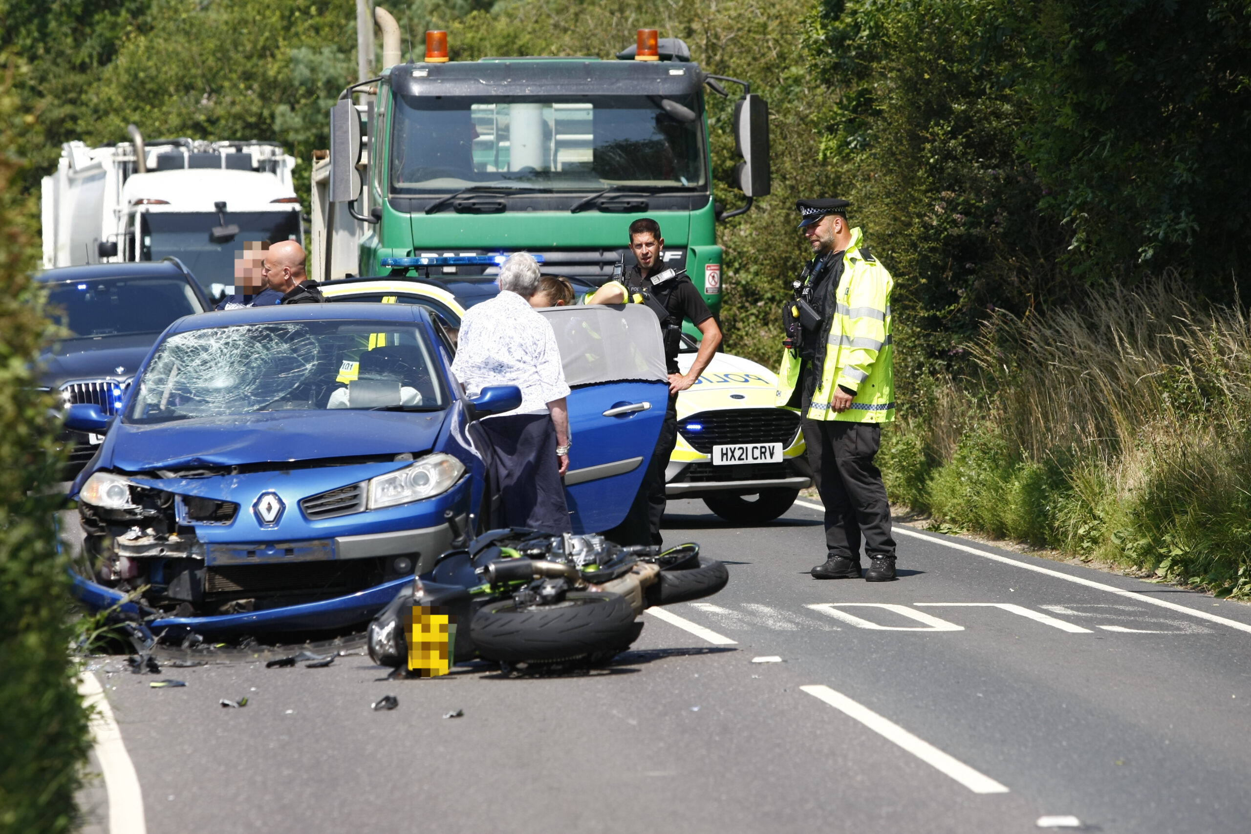 MOTORCYCLE AND CAR COLLIDE AT DOWNEND FORCING CLOSURE OF LONG LANE