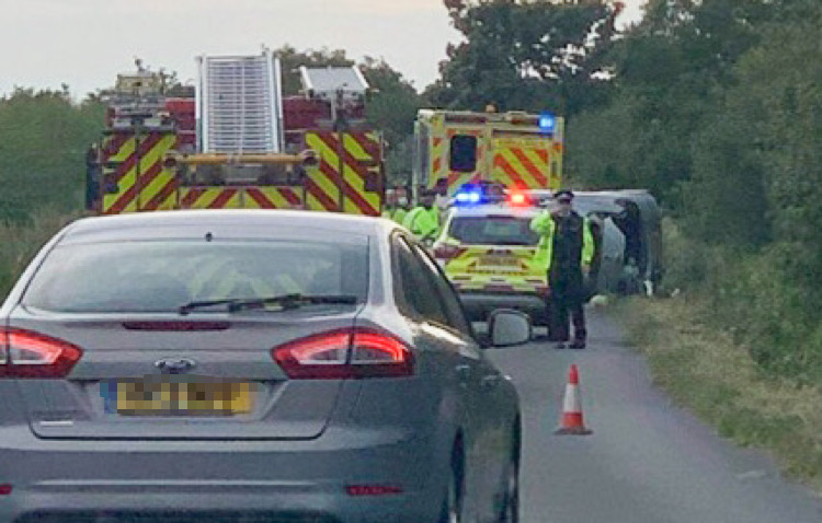 CAR ON ITS SIDE IN MIDDLE ROAD CRASH NEAR CALBOURNE