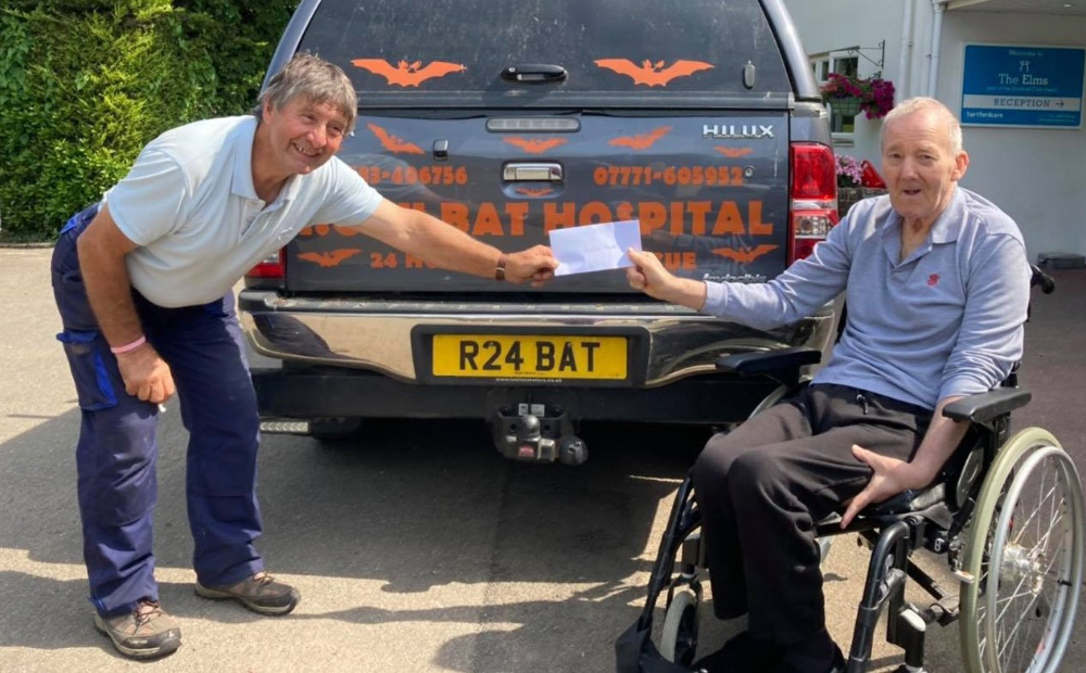 WHEN BATMAN MET ROBIN! BEMBRIDGE CARE HOME HANDS OVER CHEQUE TO BAT HOSPITAL