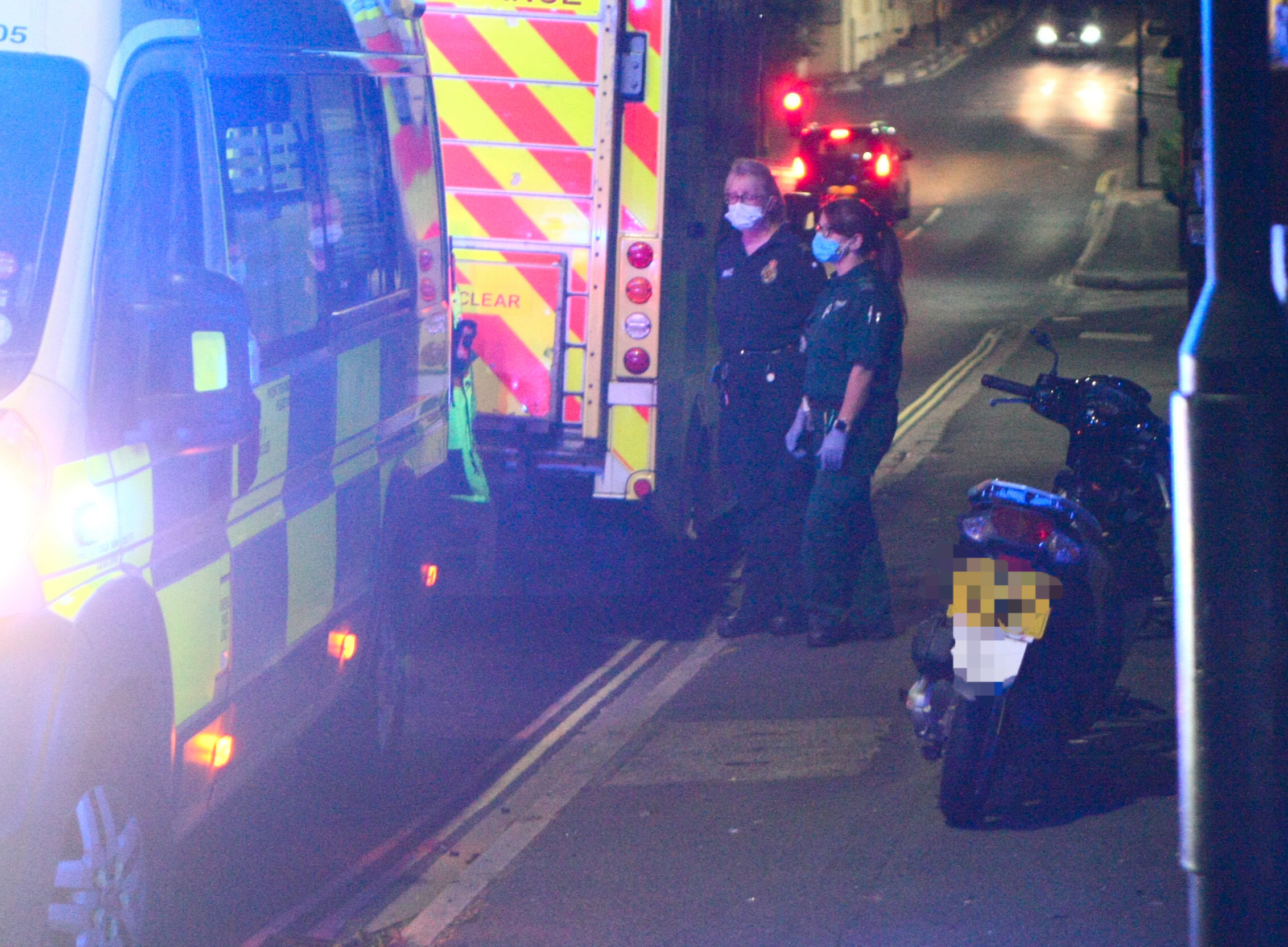 PARAMEDICS TEND TO INJURED MOTORCYCLIST IN RYDE
