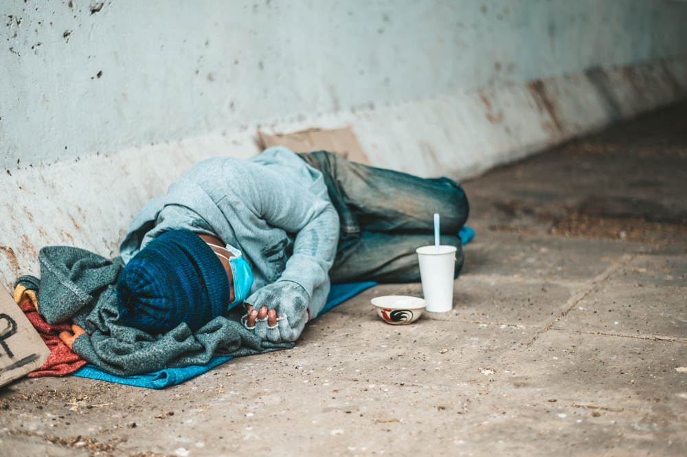 Beggars-lying-side-street-with-dirty-clothes