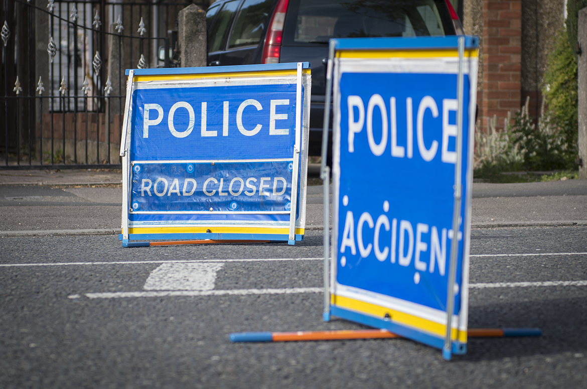 Policeroadclosedcrashaccidentdaystock