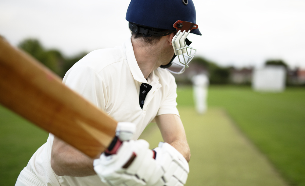 Cricketer On The Field In Action