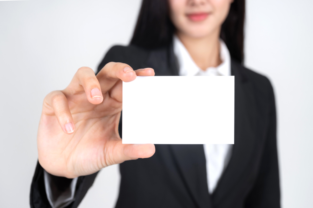 Business-woman-holding-showing-empty-business-card-name-card