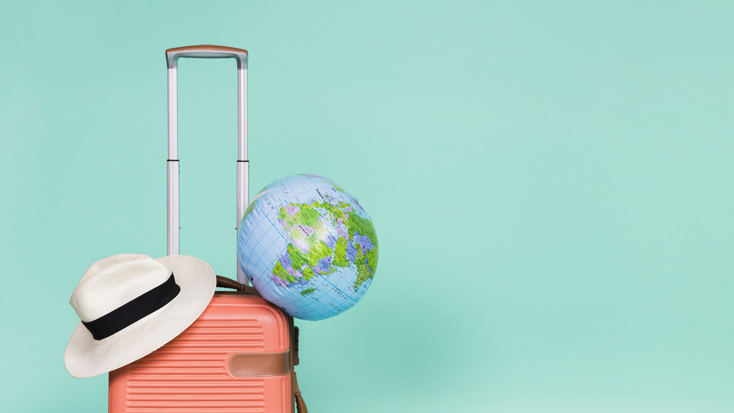 Pink-suitcase-with-hat-globe-it