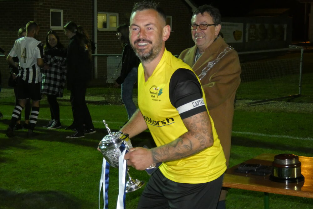 Captain Lifts Trophy
