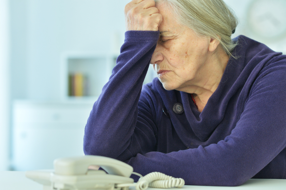 Upset Senior Woman With Phone