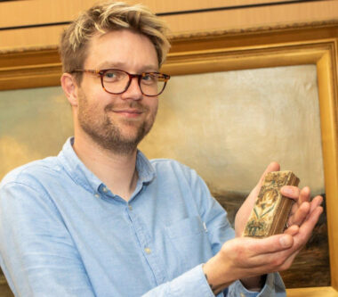 Books Expert Jim Spencer With 1630s Bible With Stumpwork Embroidery Cover - Credit Hansons