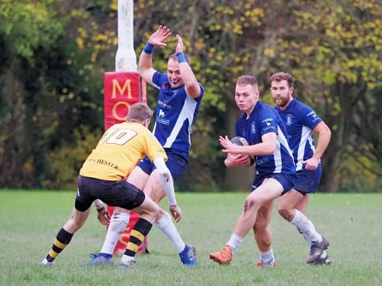 George Colleett With Ball With Dan Bell And Ben Soutter Ventnor V Winchester 251122 Gary Marsh Photo