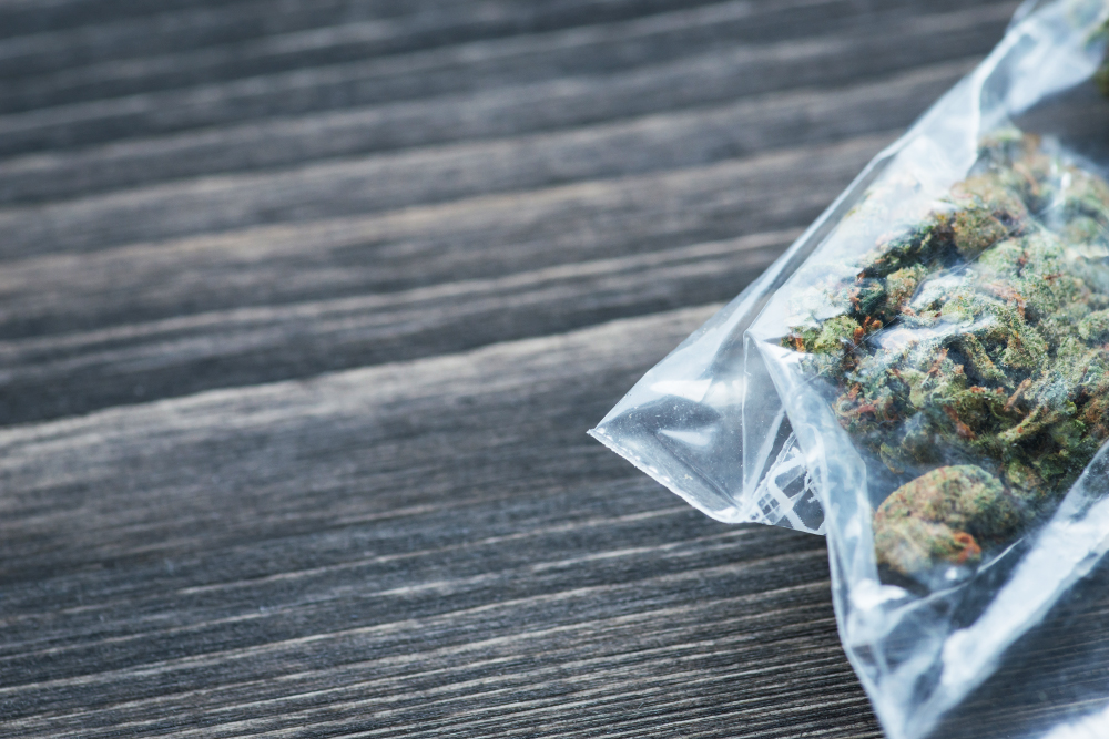 Bag With Weed On A Rustic Wooden Board
