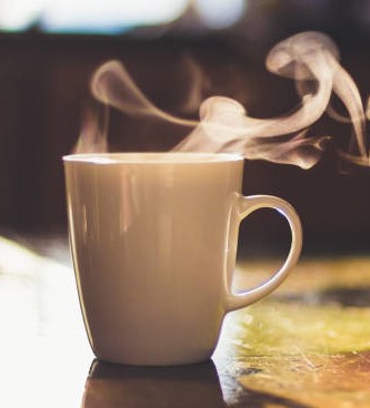 Cup Of Hot Drink On The Table