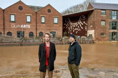 Press Image #6 (left) Liam Patrick Harrison, (right) Samuel Bossman - Standing In Front Of The Quay Arts Image Credit Charlie Price