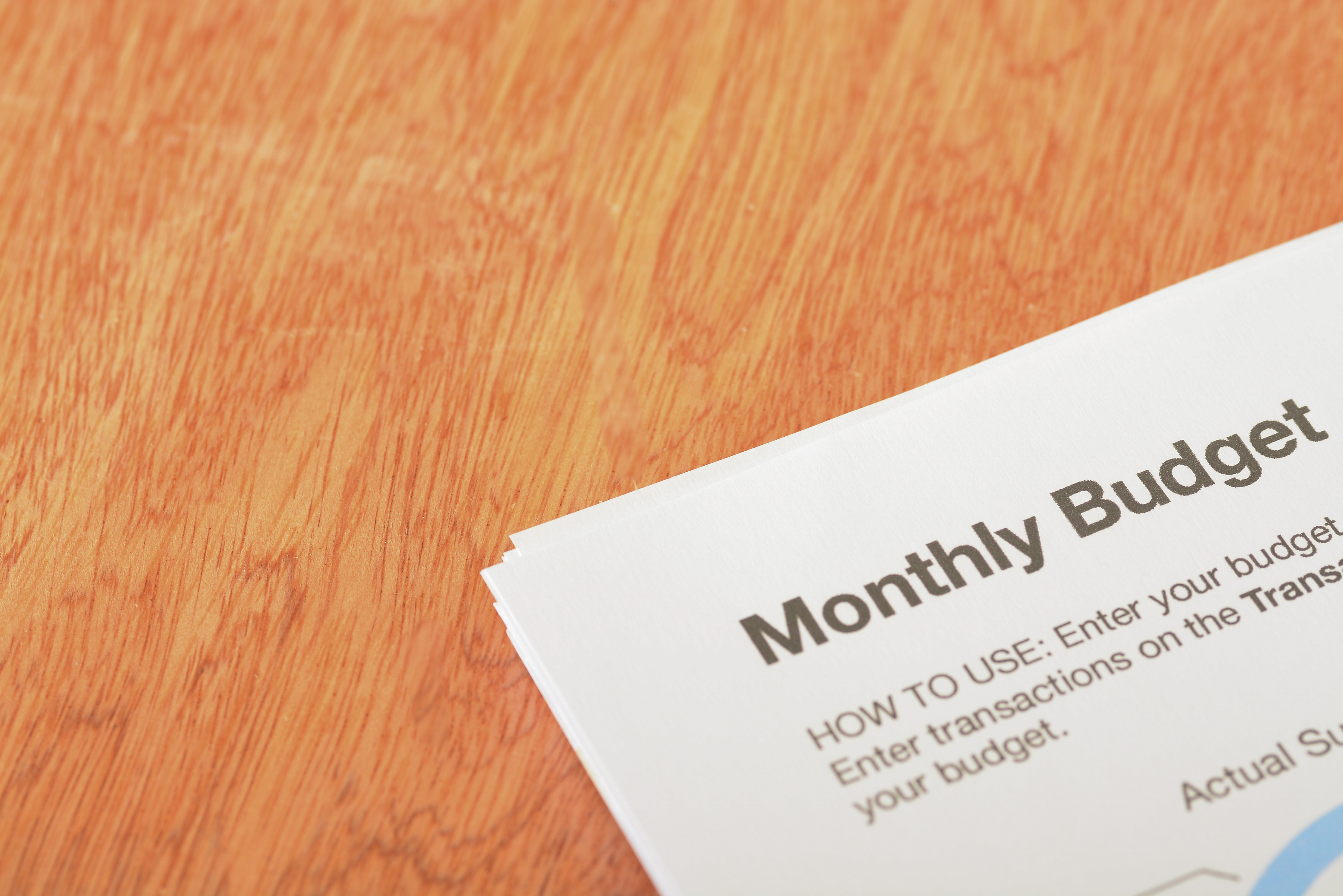 A Close-up View Of The Phrase "monthly Budget" Exemplifying The Concept Of Wise Spending.