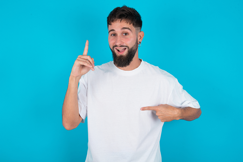 Bearded Caucasian Man Wearing White T-shirt Over Blue Background