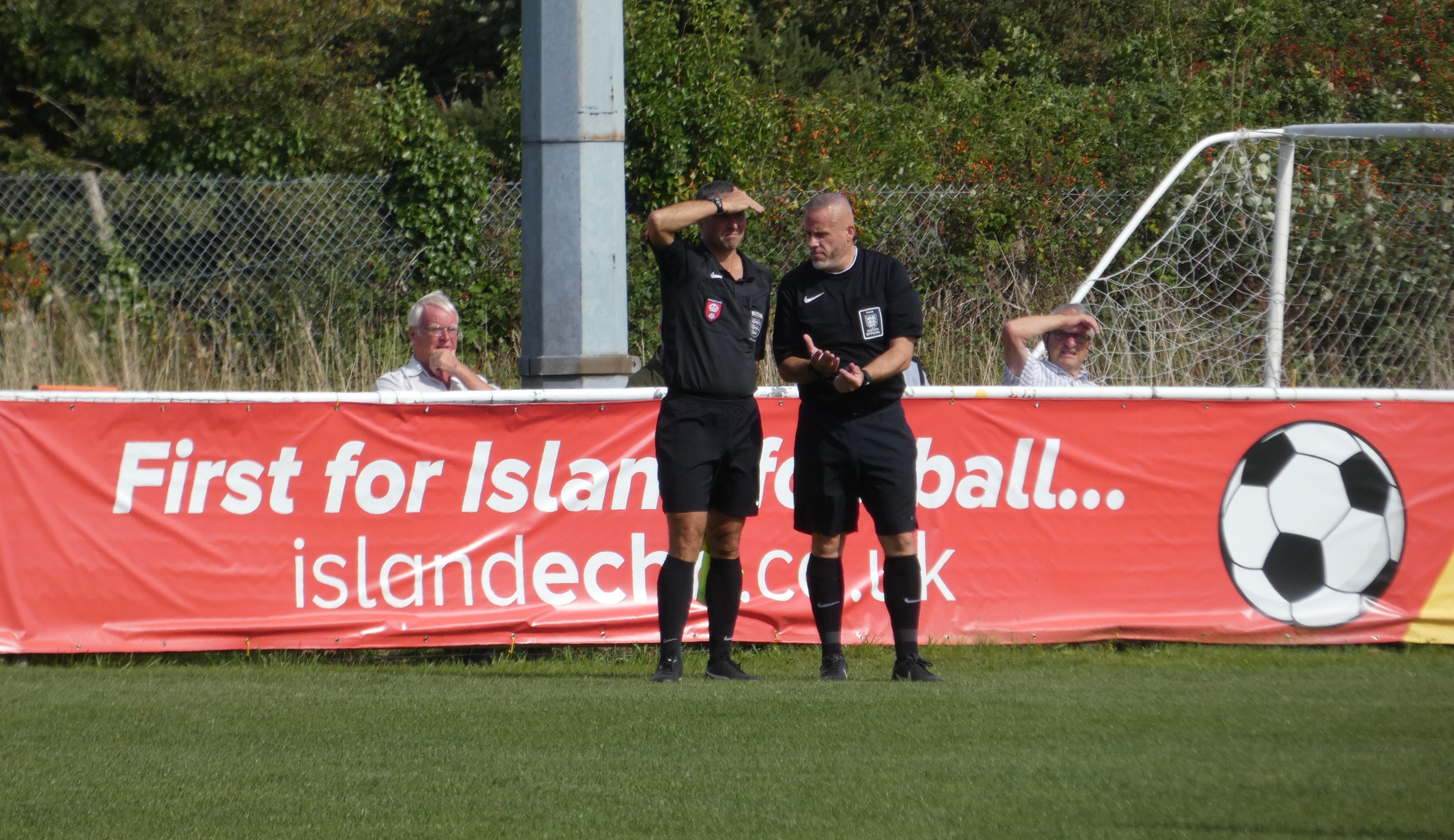 Referee Consults Linesman