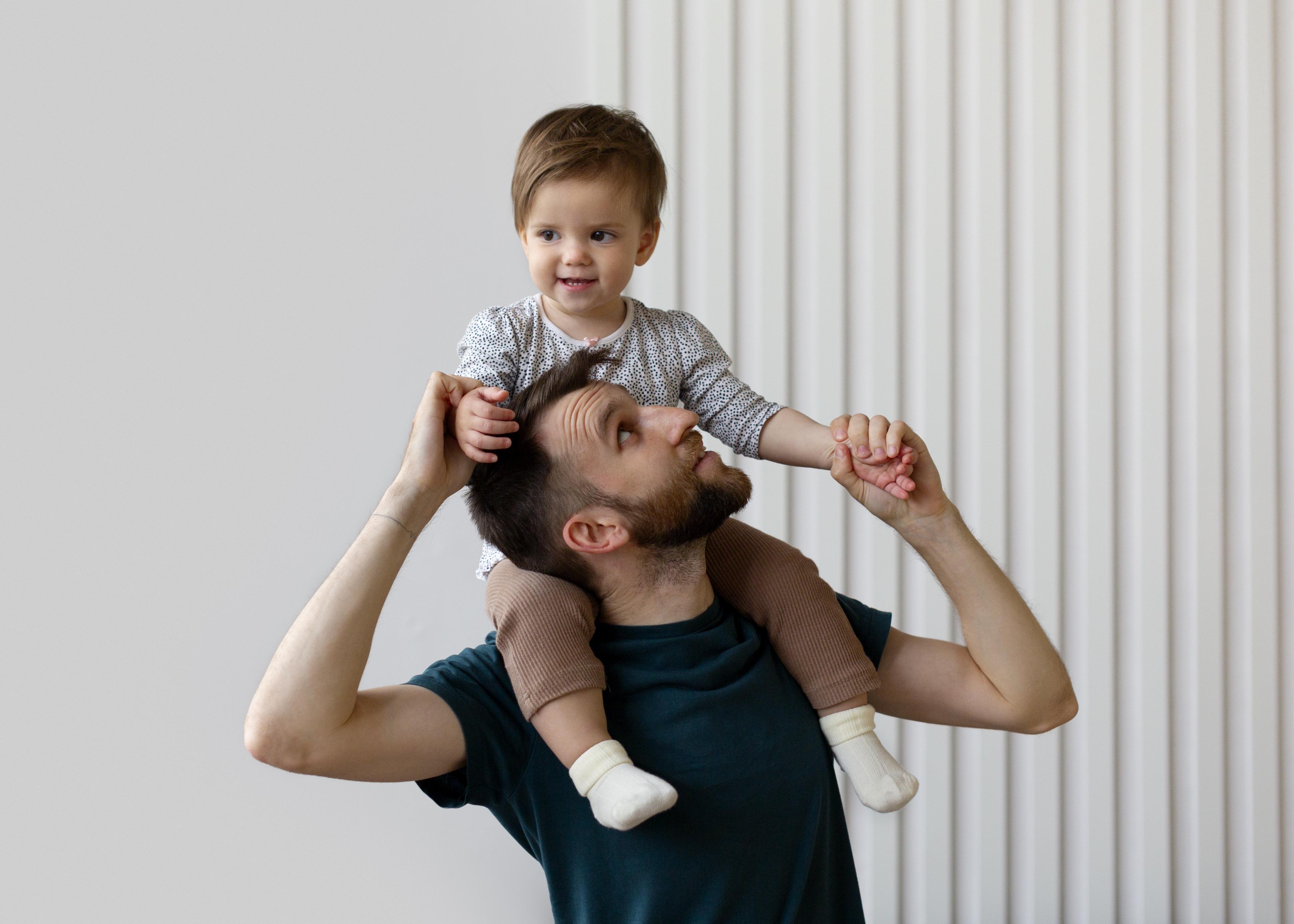 Young-father-spending-time-with-his-adorable-daughter