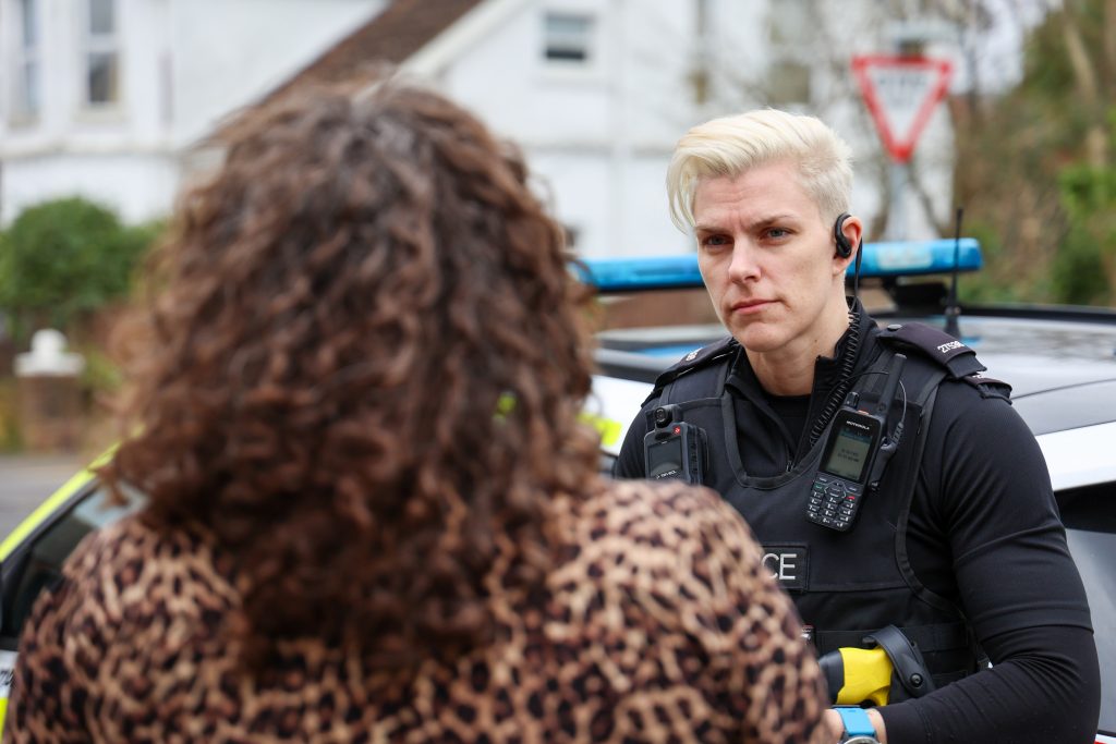 Police Officer Talking To Victim Of Crime