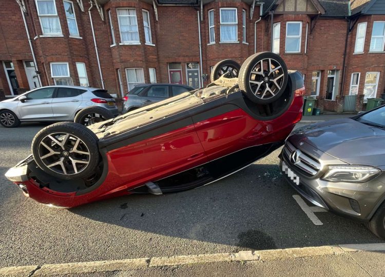 UPDATED: CAR ROLLS ONTO ROOF AFTER COLLIDING WITH PARKED CARS IN EAST COWES