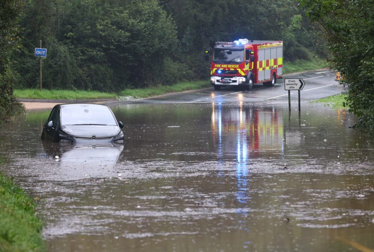 VEHICLE STRANDED AND ROADS UNDERWATER AS FLASH FLOODING HITS