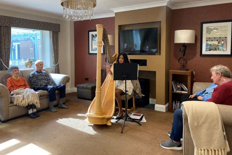 RESIDENTS ENJOY A MAGICAL AFTERNOON OF HARP MUSIC