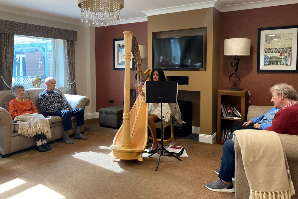 RESIDENTS ENJOY A MAGICAL AFTERNOON OF HARP MUSIC