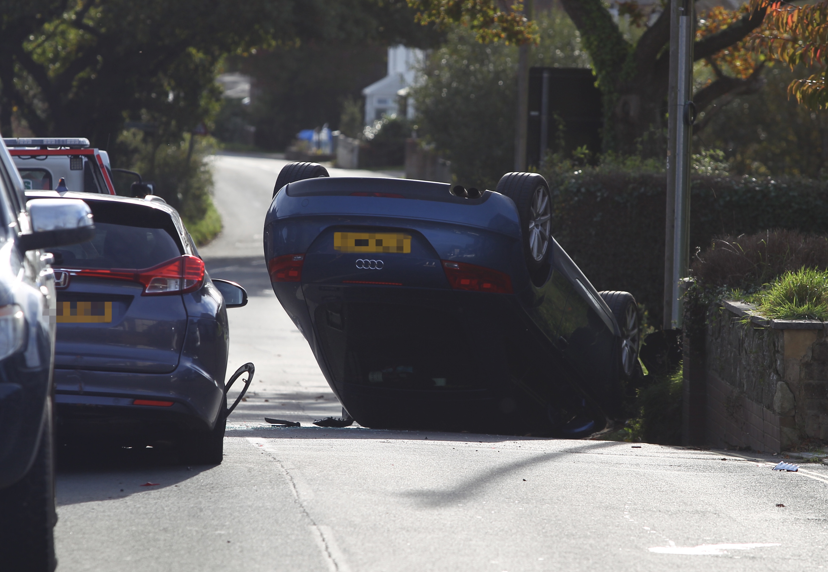 CAR ON ROOF BLOCKS RESIDENTIAL ROAD IN APSE HEATH