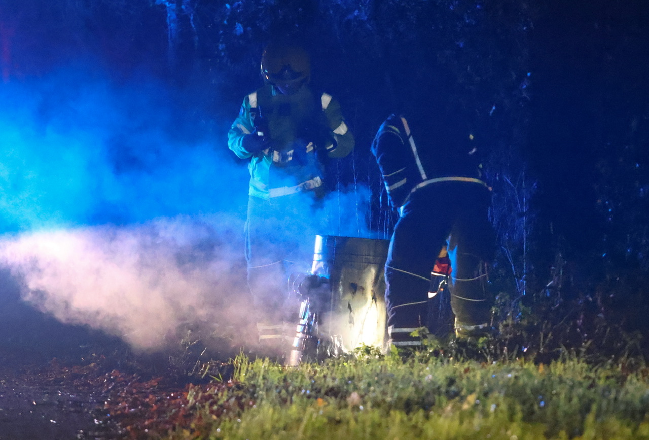 BIN BLAZE AT ASHEY LEAVES MELTED PLASTIC MESS IN LAY-BY