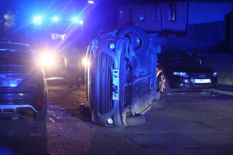 UPDATED: CAR FLIPS ONTO SIDE IN PAN ESTATE CRASH WITH PARKED CAR
