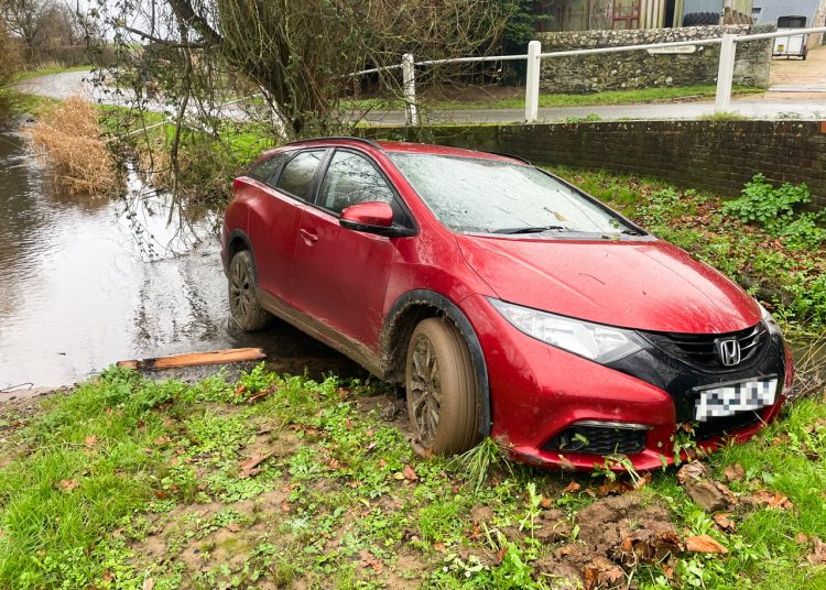 CIVIC TAKES A DIP AS DRIVER CRASHES THROUGH RAILINGS IN BRIGHSTONE