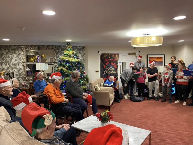THERAPY ANIMALS AND CHRISTMAS CAROLS ENJOYED BY ORCHARD HOUSE RESIDENTS