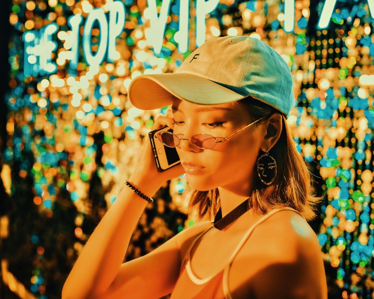 Woman holding a phone on right ear