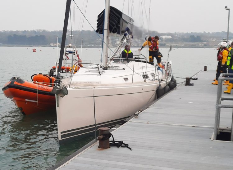 SPINNAKER WRAPPED AROUND PROP SEES LIFEBOAT CALLED OUT TO OSBORNE BAY