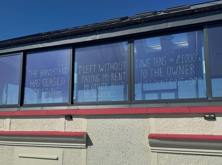 SANDOWN’S THE BANDSTAND HAS CLOSED – AND AN INTERESTING MESSAGE HAS APPEARED IN THE WINDOW