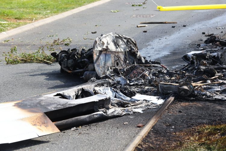 MIRACLE ESCAPE AS PLANE CRASHES INTO CARAVAN PARK AND BURSTS INTO FLAMES