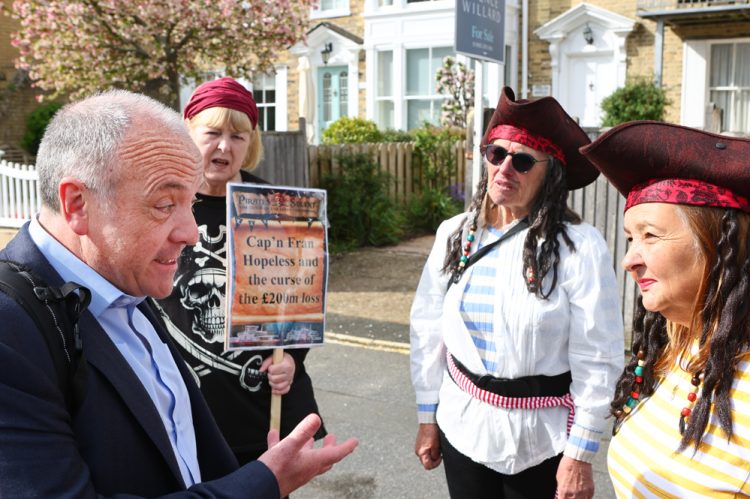 PROTESTERS CHANT ‘ROBBING OUR ISLAND’ AS TRANSPORT MINISTER MEETS FERRY BOSSES