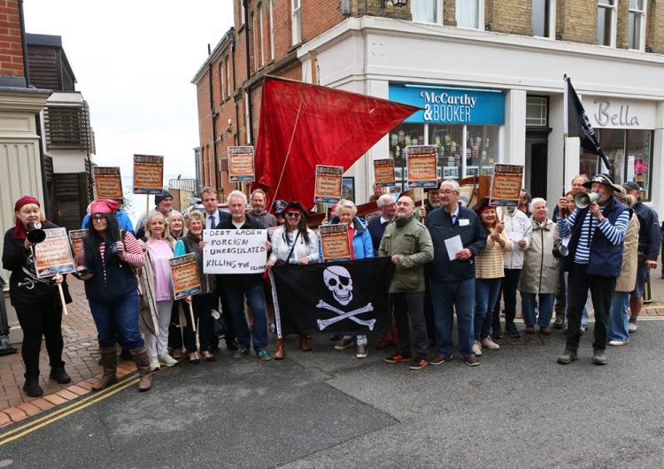 PROTESTERS CHANT ‘ROBBING OUR ISLAND’ AS TRANSPORT MINISTER MEETS FERRY BOSSES