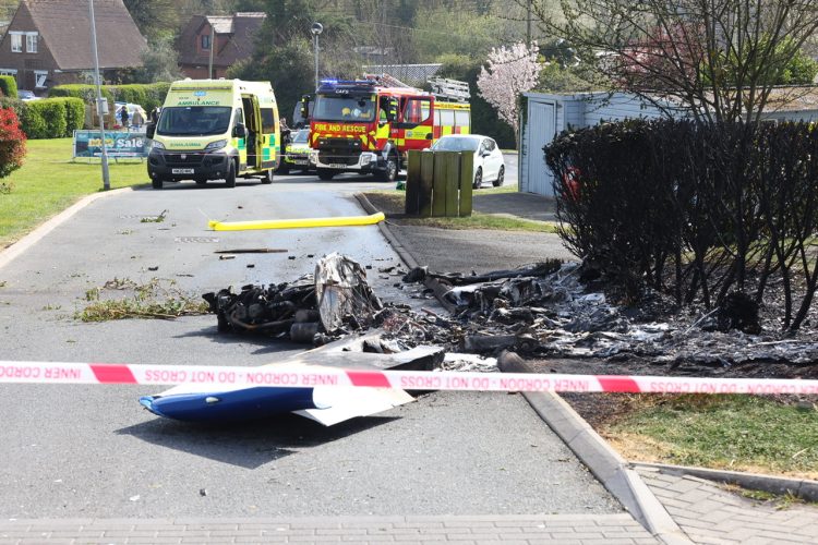 MIRACLE ESCAPE AS PLANE CRASHES INTO CARAVAN PARK AND BURSTS INTO FLAMES