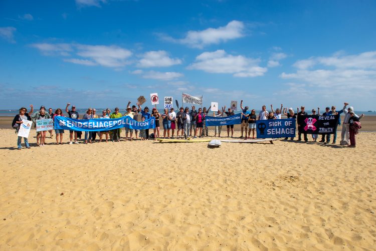 SURFERS AGAINST SEWAGE STAGE PROTEST AGAINST POO-LUTION AT APPLEY BEACH