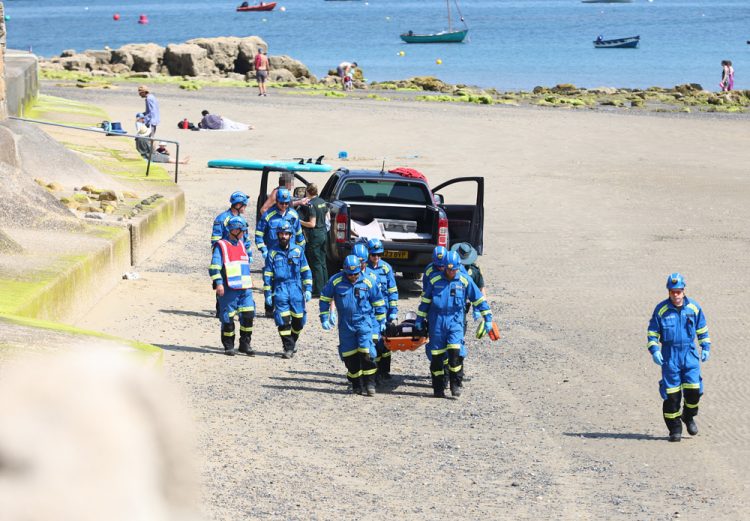 INJURED WOMAN STRETCHERED OFF THE BEACH AT SEAVIEW BY COASTGUARDS