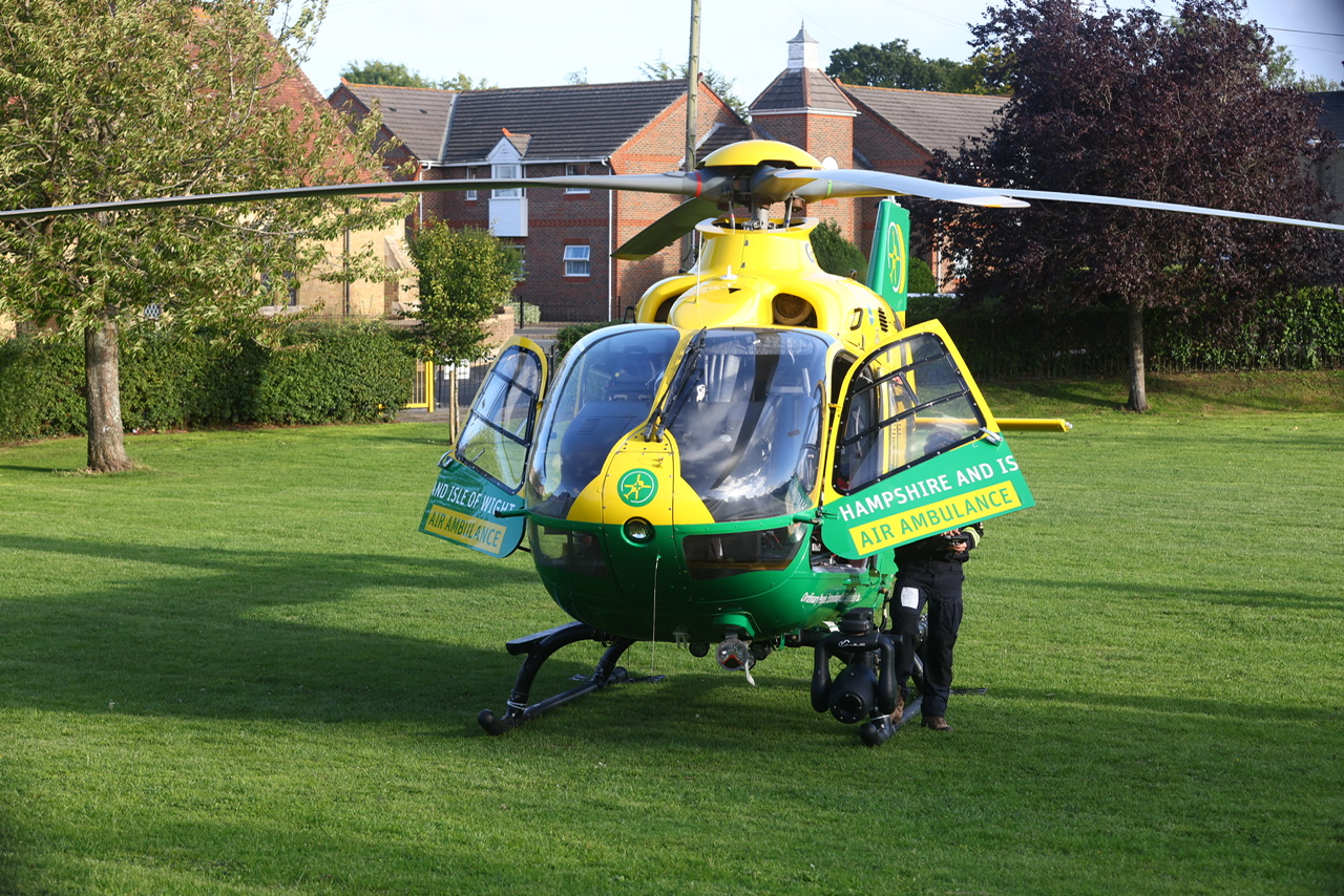 CRITICAL EMERGENCY IN BINSTEAD SEES AIR AMBULANCE LAND AT LOCAL REC