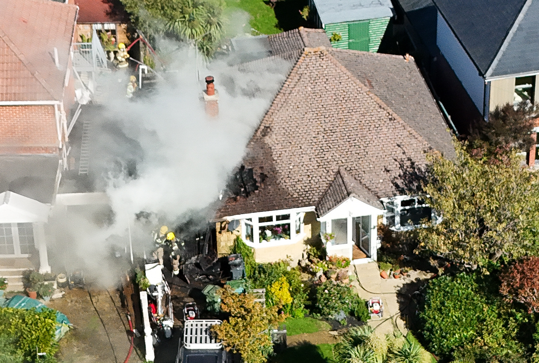 FIRE CREWS BATTLE GARAGE BLAZE AS IT SPREADS TO SHANKLIN BUNGALOW