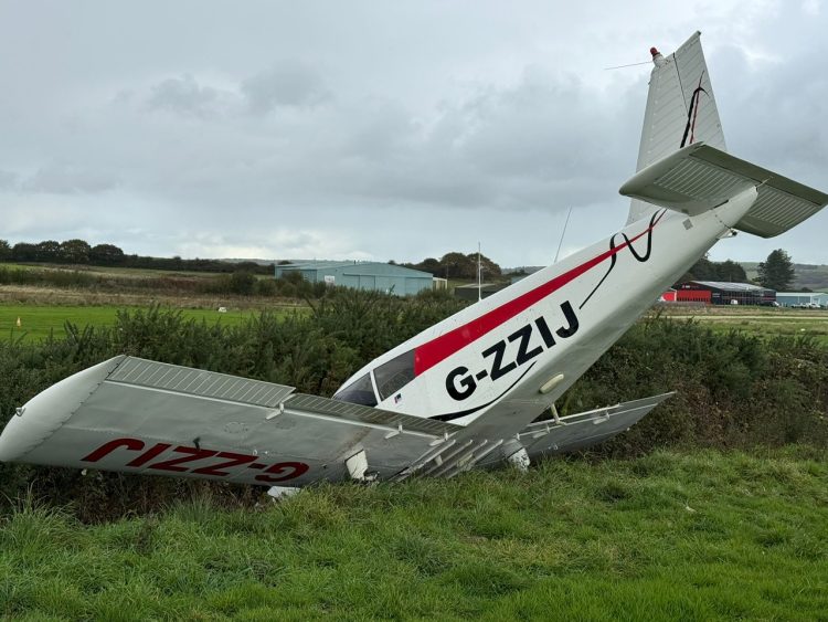 PLANE LEFT NOSEDOWN IN DITCH AT SANDOWN AIRPORT