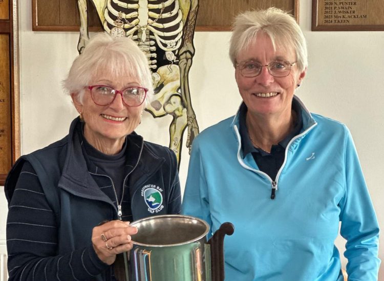 EVITTS AND MORRIS LIFT CHAMPAGNE TROPHY AT FRESHWATER BAY GOLF CLUB